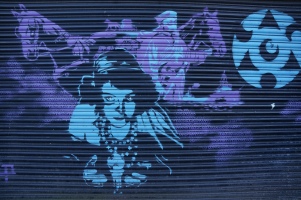Woman on Shutters Street Art - Camden